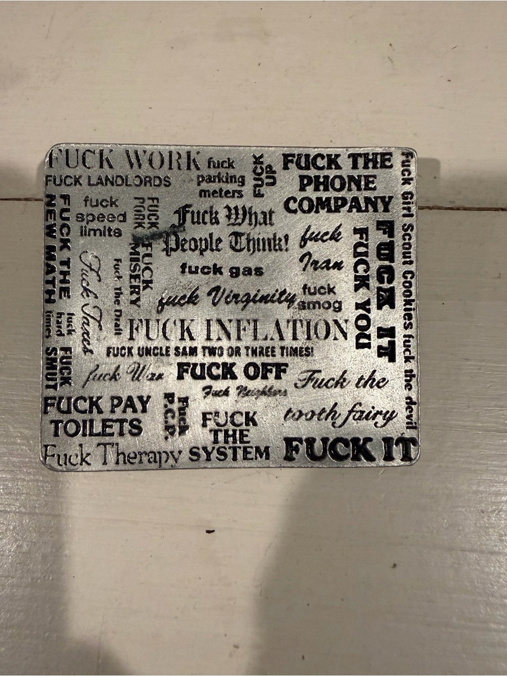 Silver and Black Word Art 2000 belt buckle.